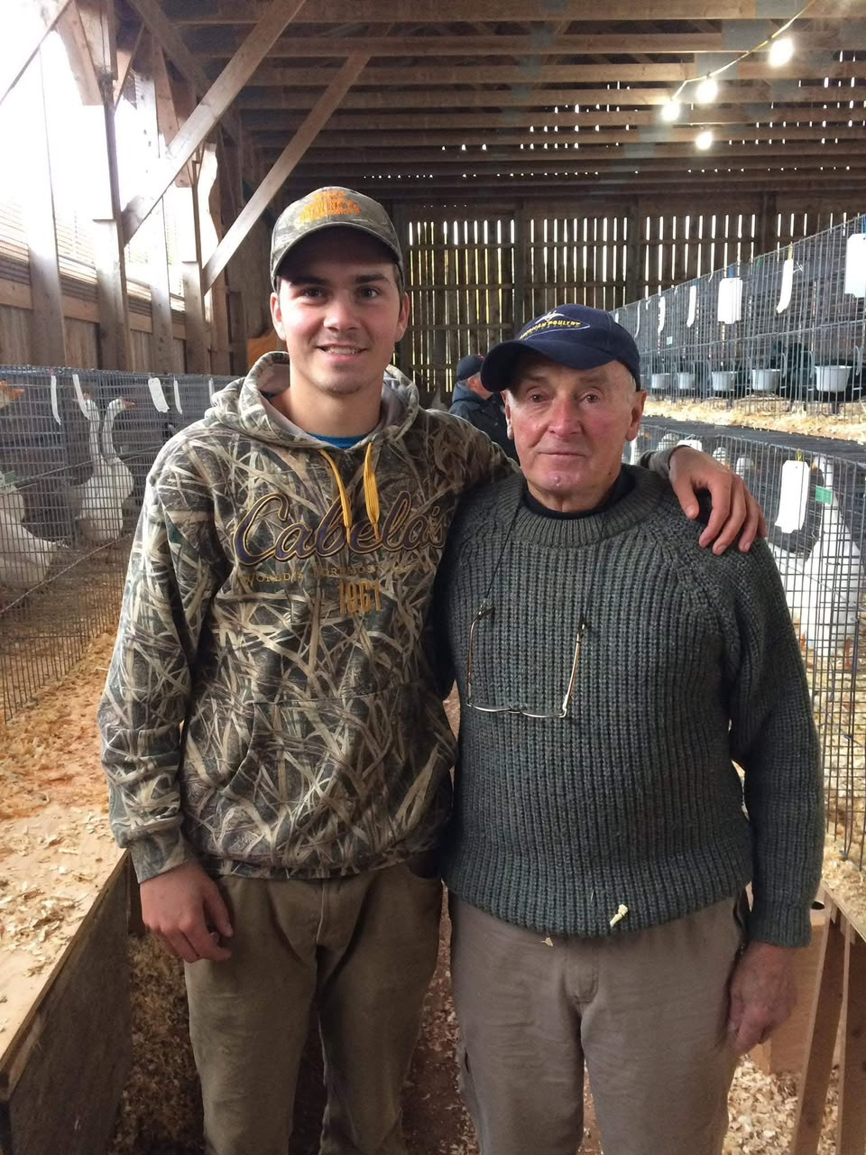 Willow Creek Poultry family inside the poultry barn